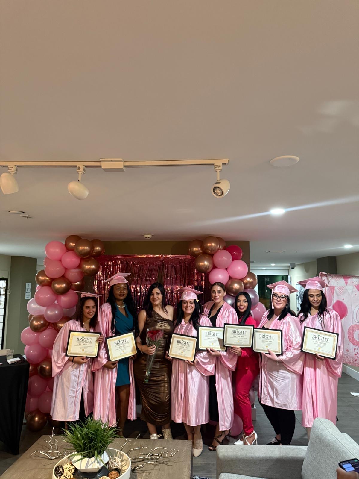 Yoselin with her students at a graduation ceremony